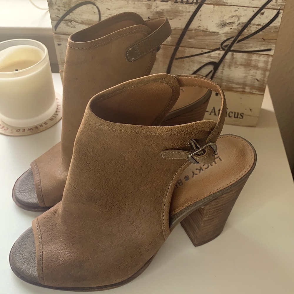 Peep toe booties with cut out heel.